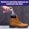 Spraying shoe deodorizer with tea tree oil on a boot.